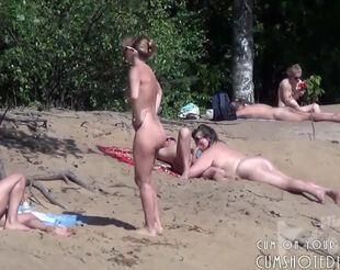 Blowage on naked beach from spy camera