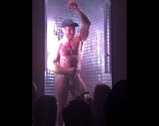 Boy dancing nude in the night club