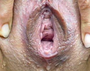 Opened Cougar slit peeing close up